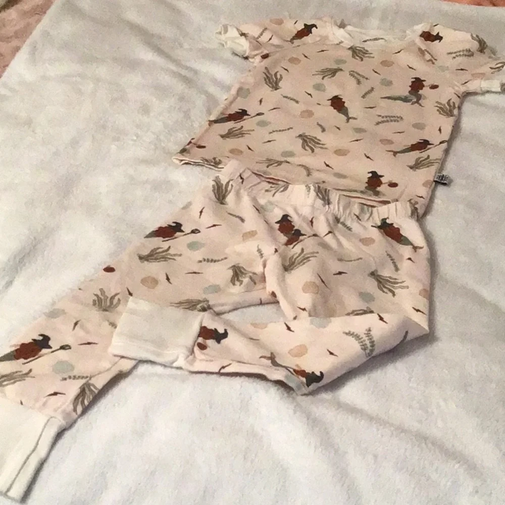 Orange pumpkin print girls dress in a neutral mermaid PJ set